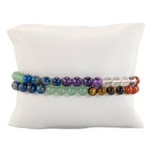 Load image into Gallery viewer, 6mm 7 Chakra Healing Bracelet on a pillow displayed on a white background - Down to Earth