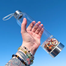 Load image into Gallery viewer, "A clear water bottle with a bottom chamber filled with 7-chakra crystal chips," - Down to Earth.