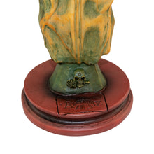 Load image into Gallery viewer, "Decorative object with a green and orange top and red base on a white background," - Down to Earth.