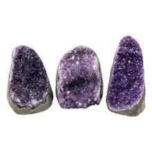 Load image into Gallery viewer, "Three Amethyst Cluster Geodes that stand at approximately 2 to 3.5 inches tall on a white background," - Down to Earth.