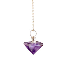 Load image into Gallery viewer, "Close-up of an Amethyst Pyramid Pendulum on a white background," - Down to Earth.