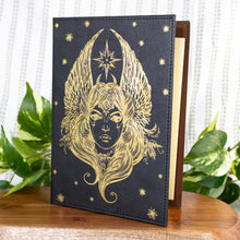 Load image into Gallery viewer, Angel with Wings Journal front facing on a style background - Down To Earth