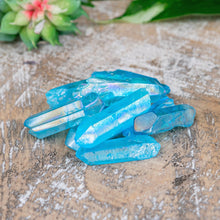 Load image into Gallery viewer, Aqua Aura Quartz Crystal Point on a wooden surface high angle styled photo - Down to Earth