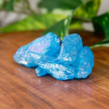 Load image into Gallery viewer, Blue Aura Quartz Raw on a wooden surface - Down to Earth