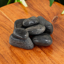 Load image into Gallery viewer, Black Tourmaline Tumbled on a wooden surface - Down to Earth