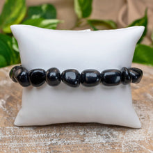 Load image into Gallery viewer, Black Obsidian Tumbled Stone Bracelet on White Pillow Styled Photo - Down To Earth