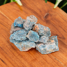 Load image into Gallery viewer, Blue Apatite Raw on a wooden surface - Down to Earth