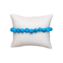 Load image into Gallery viewer, Blue Howlite Tumbled Crystal Bracelet on a pillow displayed on a white background - Down to Earth