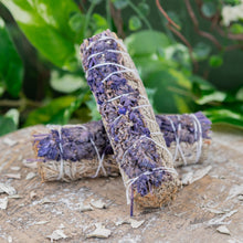 Load image into Gallery viewer, Blue Sage with Lavender Smudge Stick on a wooden surface top angle styled photo - Down to Earth