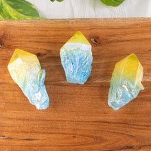 Load image into Gallery viewer, Blue & Yellow Aura Quartz Point Group Photo top down on a style background - Down To Earth