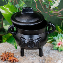 Load image into Gallery viewer, Cast Iron 3" Triple Moon Goddess Cauldron on a wooden surface styled photo - Down to Earth
