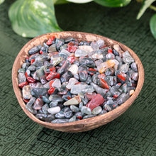 Load image into Gallery viewer, Bloodstone Crystal Chips in a coconut shell side angle styled photo - Down to Earth
