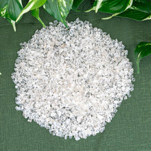 Load image into Gallery viewer, Clear Quartz Crystal Chips on a green cloth styled photo - Down to Earth