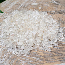 Load image into Gallery viewer, Clear Quartz Crystal Chips on a wooden surface styled photo - Down to Earth