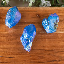 Load image into Gallery viewer, Cobalt Aura Quartz Point side top down on a style background - Down To Earth
