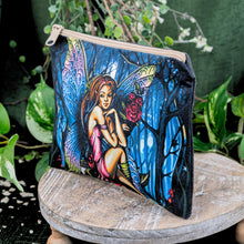 Load image into Gallery viewer, The Cosmic Fairy Bag side angle on a wooden surface with greenery in the background - Down to Earth