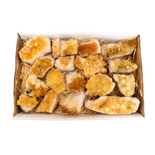 Load image into Gallery viewer, "Cardboard box completely filled with Citrine Druze crystals on a white background," - Down to Earth.