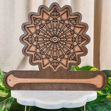 Load image into Gallery viewer, "Decorative Crystal Grid Incense Holder with an evil eye design on a granite surface with green foliage in the background," - Down to Earth.