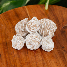 Load image into Gallery viewer, Desert Rose on a wooden surface low angle - Down to Earth