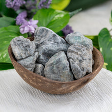 Load image into Gallery viewer, Raw Emerald side angle in a coconut shell - Down To Earth