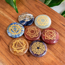 Load image into Gallery viewer, "Set of crystal stones with geometric patterns on a wooden surface," - Down to Earth.