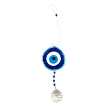 Load image into Gallery viewer, "Decorative evil eye charm with blue and white design on a white background," - Down to Earth.