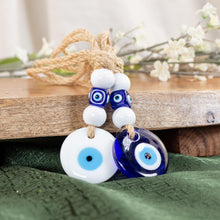 Load image into Gallery viewer, Evil Eye Mobile Hanger Group Picture with green, brown, and flower background - Down To Earth