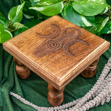 Load image into Gallery viewer, "Goddess Altar Table on a green cloth with foliage around it," - Down to Earth.
