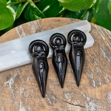 Load image into Gallery viewer, "Three Black Obsidian Crystal Goddess Statues leaning on Selenite wands," - Down to Earth.