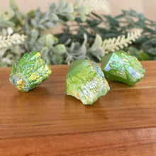 Load image into Gallery viewer, Green Aura Quartz Point side facing on a style background - Down To Earth