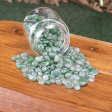 Load image into Gallery viewer, Green Aventurine Chips 1lb front facing in a jar displayed on a styled background - Down To Earth