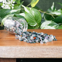 Load image into Gallery viewer, Green Moss Agate Crystal Chips 1lb front facing in a jar displayed on styled background - Down To Earth