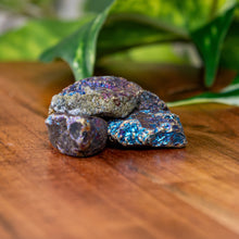 Load image into Gallery viewer, Peacock Ore Raw on a wooden surface - Down to Earth