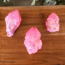 Load image into Gallery viewer, Pink Aura Quartz Point top down on a style background - Down To Earth