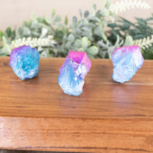 Load image into Gallery viewer, Pink & Blue Aura Quartz Points front facing on a style background - Down To Earth
