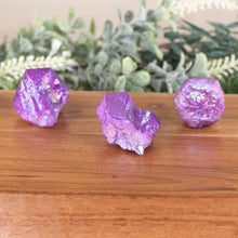 Load image into Gallery viewer, Purple Aura Quartz Point front facing on a style background - Down To Earth
