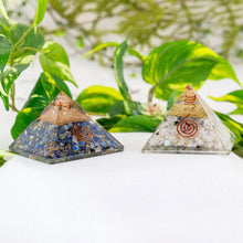 Load image into Gallery viewer, Orgonite Crystal Pyramid group photo on a white surface - Down to Earth