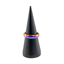 Load image into Gallery viewer, "Black cone-shaped object with a rainbow-colored ring on a white background," - Down to Earth.