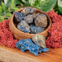 Load image into Gallery viewer, Azurite Raw displayed on a wooden surface with a colorful background second angle - Down to Earth