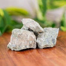 Load image into Gallery viewer, Rhyolite Raw on a wooden surface - Down to Earth