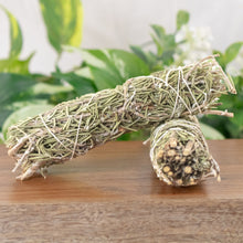 Load image into Gallery viewer, Rosemary Smudge Stick front facing displayed on a styled background - Down To Earth