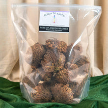 Load image into Gallery viewer, "Bag of Rose of Jericho flowers with 'Down to Earth' label on a green fabric with a beige background," - Down to Earth.