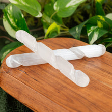 Load image into Gallery viewer, Selenite Spiral Massage Wands stacked on a wooden surface - Down to Earth
