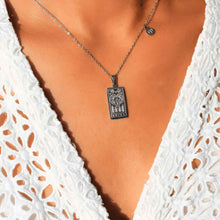 Load image into Gallery viewer, Silver Zodiac Tarot and Astrology Necklace on a Woman - Down To Earth