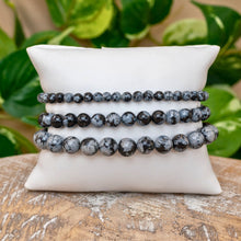 Load image into Gallery viewer, "A set of three Snowflake Obsidian Crystal Energy bracelets in the sizes 4mm, 6mm, and 8mm," - Down to Earth.