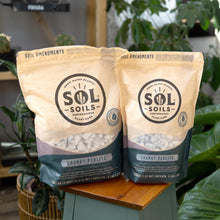 Load image into Gallery viewer, Sol Soils Chunky Perlite up close with plants displayed on a styled background - Down to Earth