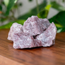 Load image into Gallery viewer, Strawberry Calcite Raw Brazil on a wooden surface - Down to Earth