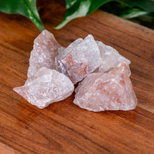 Load image into Gallery viewer, Strawberry Calcite Raw Pakistan on a wooden surface high angle - Down to Earth