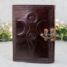 Load image into Gallery viewer, Triple Moon Goddess Leather Journal front facing with plants displayed on a styled background - Down To Earth