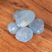 Load image into Gallery viewer, Celestite Quartz Tumbled on a wooden surface high angle - Down to Earth